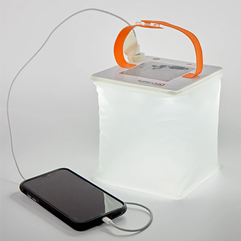 Luminaid Packlite Max 2-in-1 Phone Charger Solar Lantern on a gray background